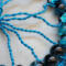 extreme detailed wire branches strung crackle glass beads, wire branches, and a yarn-wrapped hoop. Handmade by Beneath the Oak Designs.